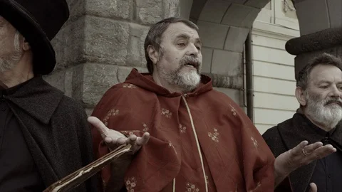 Slow Mo Priest Giving Explanation Stock Footage 120407754
