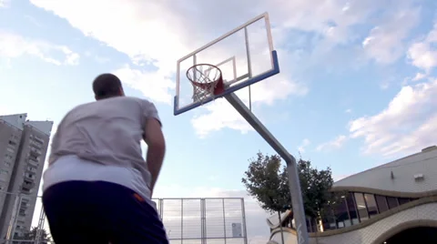 Slow-Mo: Professional Basketball Player Scores A Basket Performing Alley-Oop Stock Footage 39671265