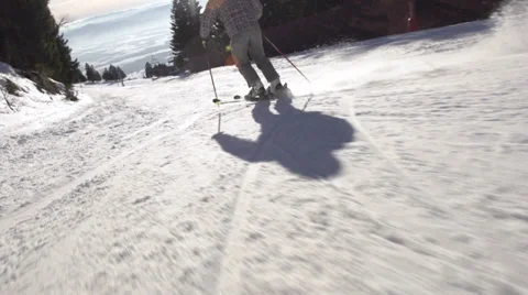 Slow-Mo: Rear View Of Skier Carving Down Steep Slope Stock Footage 34519871