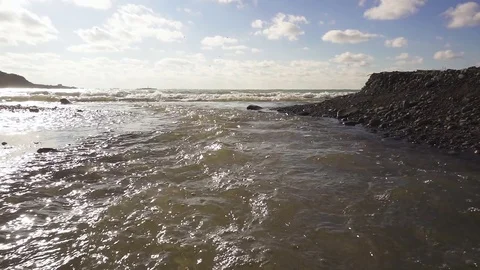Slow Mo River flows into the sea Stock-Footage 82866200