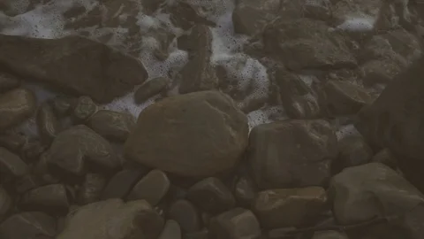 Slow mo on the rocks on the shore rolling waves Stock-Footage 81353291