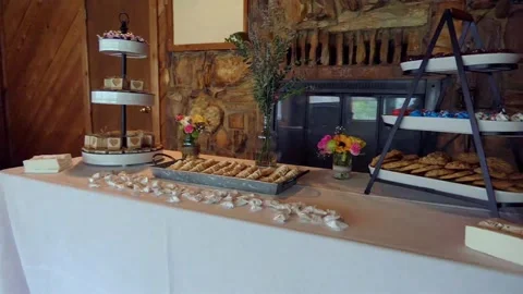 Slow-mo scanning various inviting confections arrayed on a table before wedding 库存影片 232160419