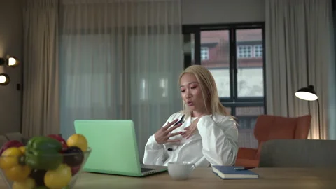 Slow-mo: Slow-mo: Young Southeast Asian Doctor Giving Online Advice via Stock Footage 136364938