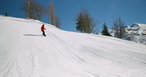 Slow Mo Of Snowboarder Going Down Snowy Hill Stock Footage 140317923