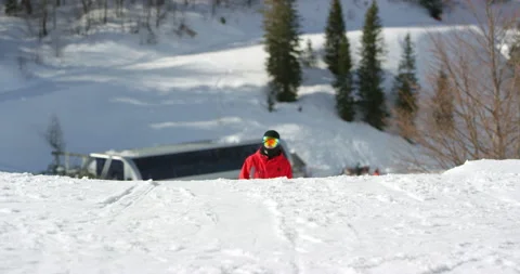 Slow Mo Of Snowboarder Walking Uphill Stock Footage 139397480