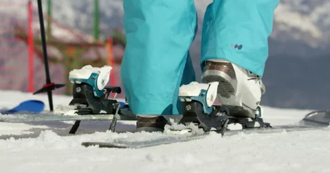Slow Mo Of Someone Clipping Snow Boots To Skis Stock Footage 139461981