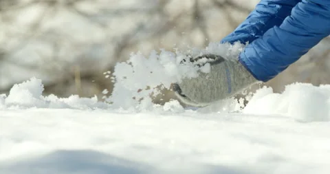 Slow Mo Of Someone Making Snowballs Stock Footage 139760588