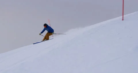 Slow Mo Of Someone Skiing On Snowy Hill Stock Footage 139763084
