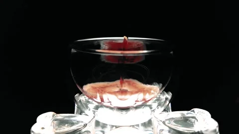 Slow-Mo: Sparkling Dark Liquid in Sphere Glass Stock Footage 308179251