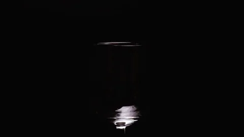 Slow mo splashes of red wine in glass Stock Footage 71713483