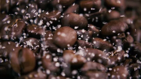 Slow mo. Sprinkle coffee beans with sugar Stock Footage