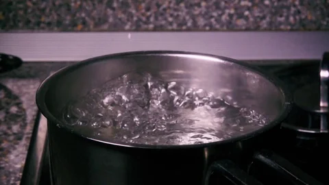 Slow mo sprinkle salt in the pan Stock Footage 71857632
