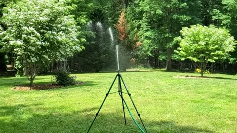 Slow Mo Sprinkler Stock-Footage 132889613