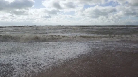 Slow mo the storm wave departs from the shore Stock Footage 82167910