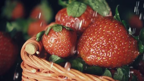 Slow mo. Strawberry in a basket under the drops Stock-Footage 75479924