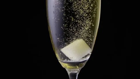 Slow mo a sugar cube in a glass Stock Footage 72561225