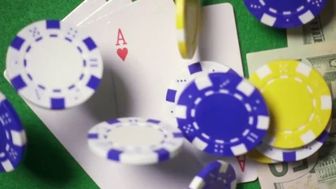 Slow mo super the game pieces fall to the casino gaming table Stock Footage 72340662