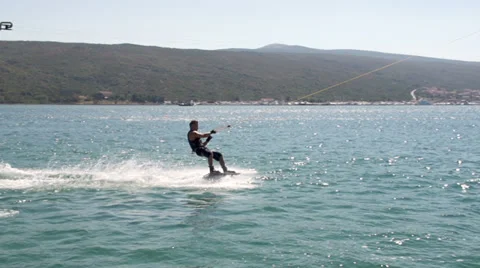Slow-Mo: Tired Wakeboarder Trying To Stop Stock Footage 36992301
