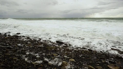 Slow mo two foam waves roll to shore Stock Footage 82025042