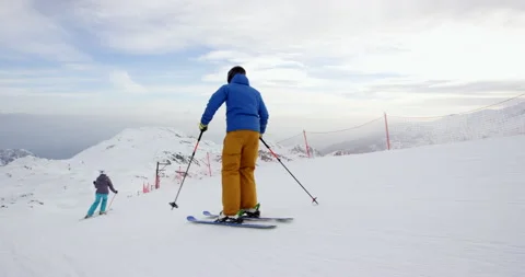 Slow Mo Of Two People Racing While Skiing Stock Footage 140189579