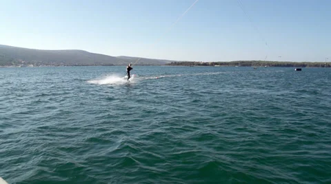 Slow-Mo: Wakeboarder Carving And Jumping In Water Stock Footage 36991309