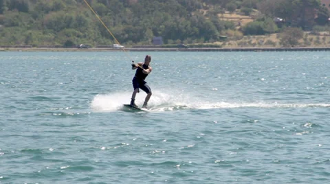 Slow-Mo: Wakeboarder Sinking Into Water Stock Footage 36991723