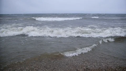 Slow mo water waves on the stone coast Baikal lake Siberia Stock Footage 96739095