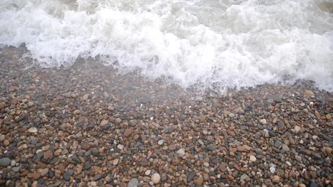 Slow mo water waves on the stone coast Stock Footage 96739097
