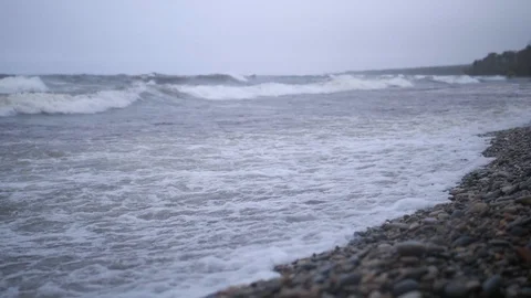 Slow mo water waves on the stone coast Baikal lake Siberia Stock Footage 96739144