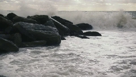 Slow mo the wave is broken on the breakwater on the shore Stock Footage 81521958