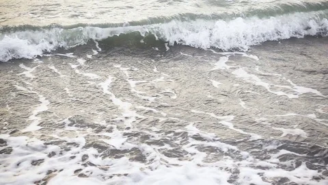 Slow mo waves roll to the shore Stock-Footage 82615083