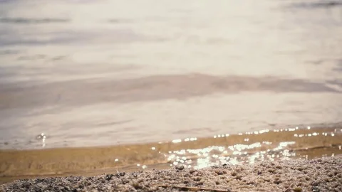 Slow mo. Waves on a sandy beach Stock Footage 76354836
