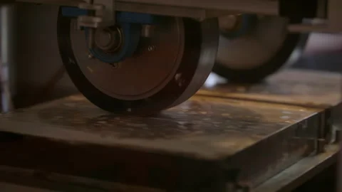 Slow-mo: Weights Running on Pieces of Asphalt for Endurance Test Stock Footage 138804100