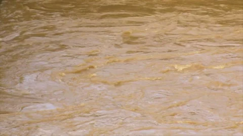 Slow mo whirpool- mud flood rushing river water 4 Stock Footage 7768849