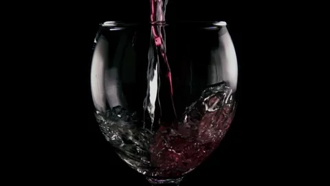 Slow mo. White and red wine is poured into the glass Stock-Footage 75955938