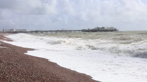 Slow-Mo of Windy Pebble Beach with High Waves and Palace Pier at the Centre Vidéo 287444803