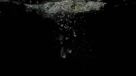 Slow mo yellow pepper falls into the water Stock Footage 149755113