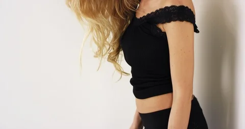 Slow Mo Young Blonde Leaning Up Against Wall Stock Footage 112180302