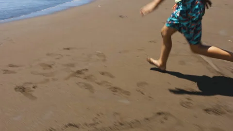 Slow-Mo | Young Boy Running on Beach Stock Footage 137763080