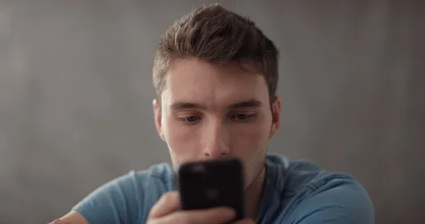 Slow Mo Young Man Using Smartphone Stock Footage 121107173