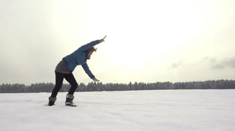 Slow-Mo: Young Woman Doing Cartwheel Out In Snow Stock Footage 33846542