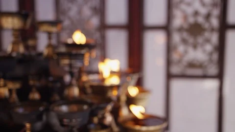 Slow moition push in shot on a temple candle fire shot on red camera  handheld Stock Footage 126952821