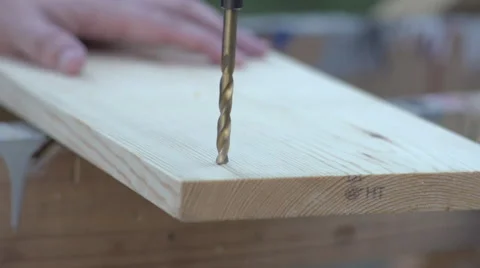 Slow Morion Large drill bit drilling into wooden board Video stock 68346795
