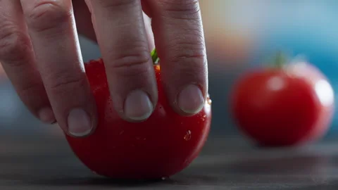 Slow Motion 1000fps: Hand Picking Fresh Tomato from Kitchen Board Stock Footage 251939362