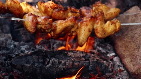 Slow Motion 120 FPS Chicken Wings Over Fire Stock Footage 302975664