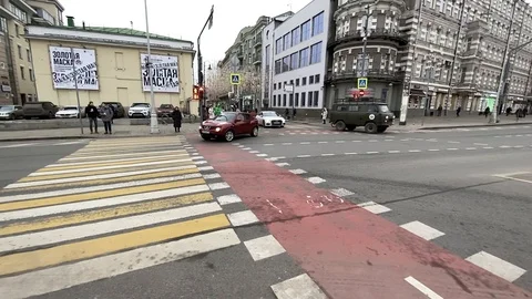 Slow motion (120 fps) pan left of a busy crossroad in Moscow Stock Footage 124196690
