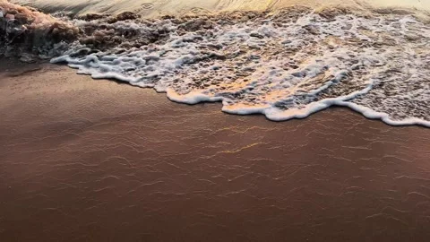 Slow motion 120fps Close Up of Gentle Foamy Wave Edge on Tropical Beach Sand Stock Footage 343595173