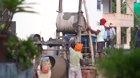Slow motion 120fps shot of construction workers unloading a hopper by climbing Stock Footage 142157663