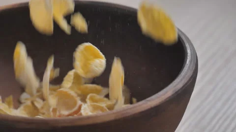 Slow motion 180 frames per second, close-up of cornflakes falling into a clay Stock Footage 150217680