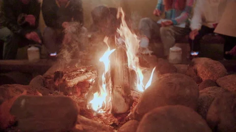 Slow motion 240 fps. Bonfire made stones in huge room, tent, burning firewood. Stock Footage 157369318
